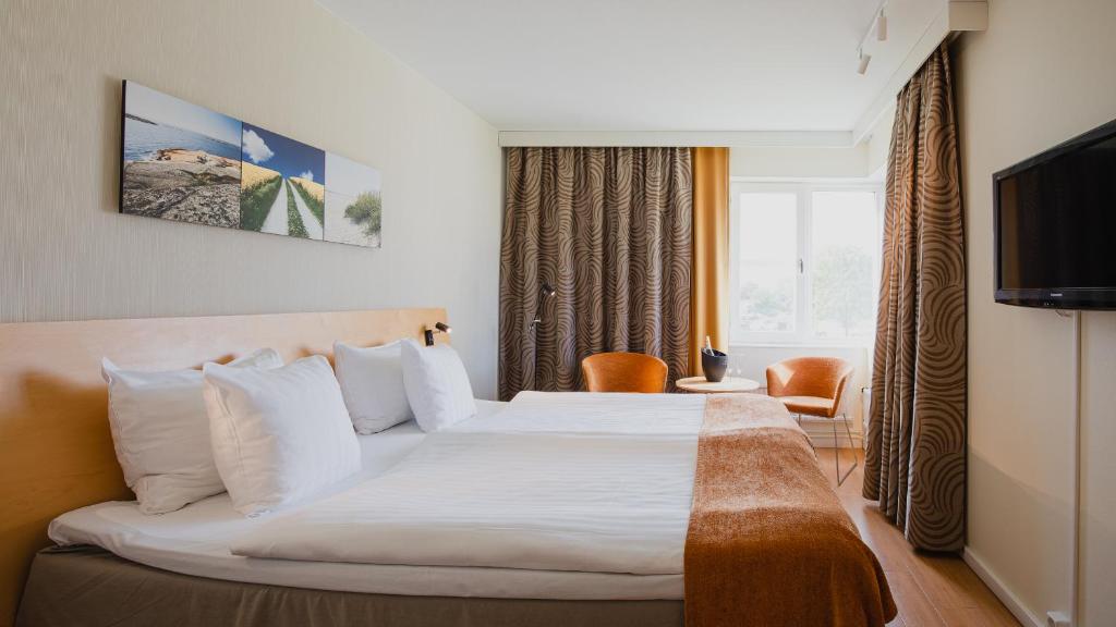 Postel nebo postele na pokoji v ubytování Hotell Erikslund