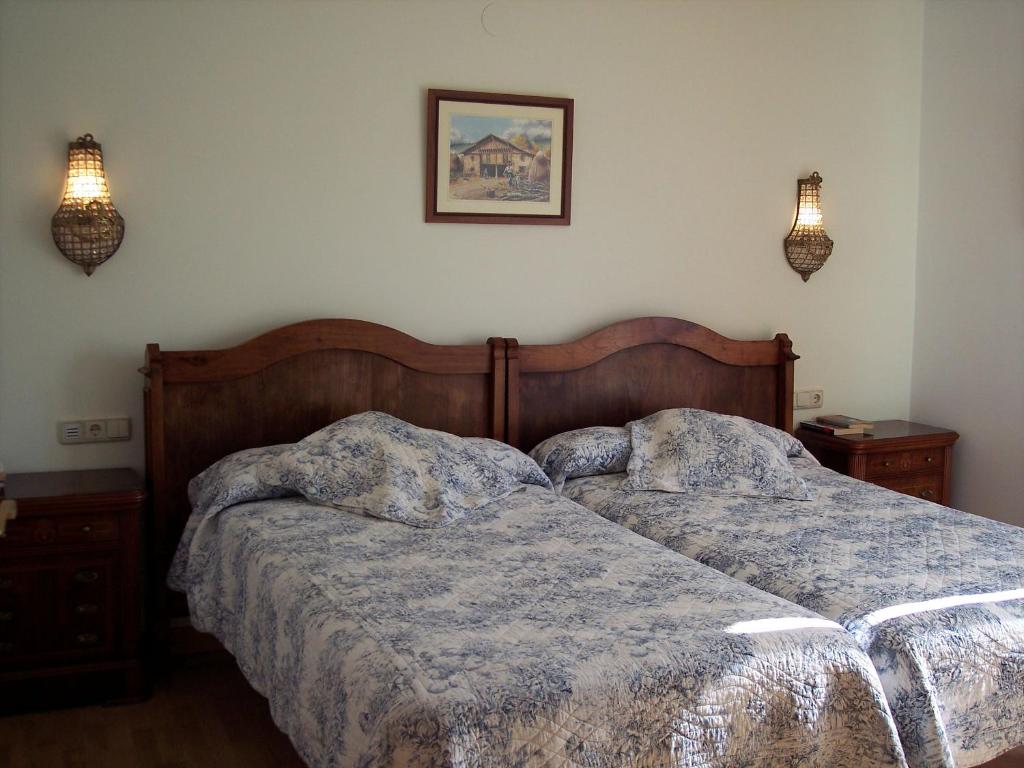 Postel nebo postele na pokoji v ubytování Hotel Azkue