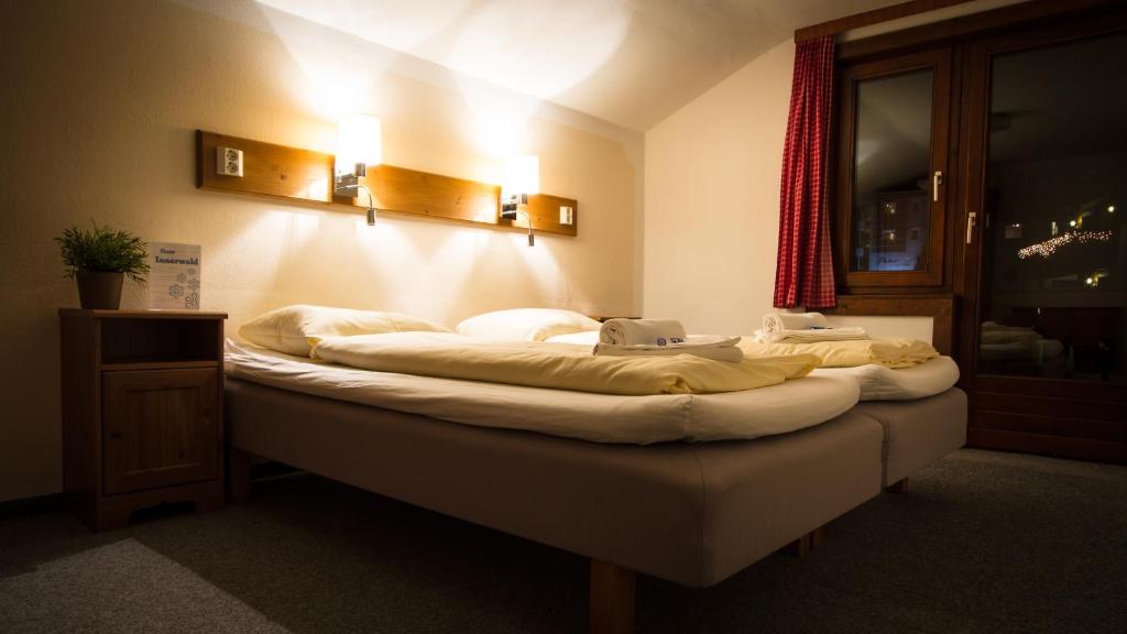 Postel nebo postele na pokoji v ubytování Haus Innerwald by Châtel Reizen