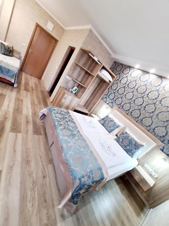 Postel nebo postele na pokoji v ubytování Lucky Hotel