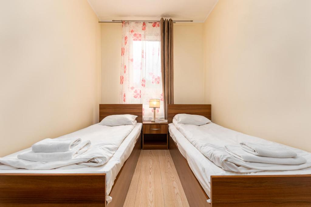 Posteľ alebo postele v izbe v ubytovaní Al Krakowska 291A by Homeprime
