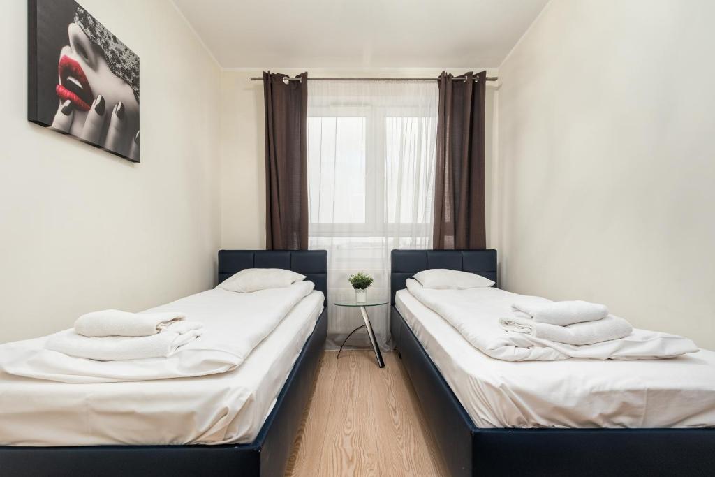 Posteľ alebo postele v izbe v ubytovaní Al Krakowska 291A by Homeprime
