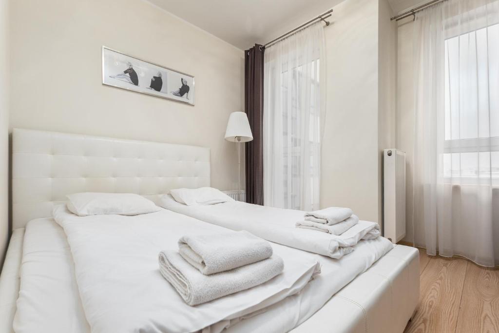 Posteľ alebo postele v izbe v ubytovaní Al Krakowska 291A by Homeprime
