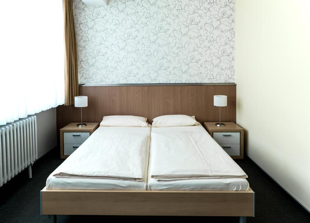 Postel nebo postele na pokoji v ubytování Hotel Flämischer Hof