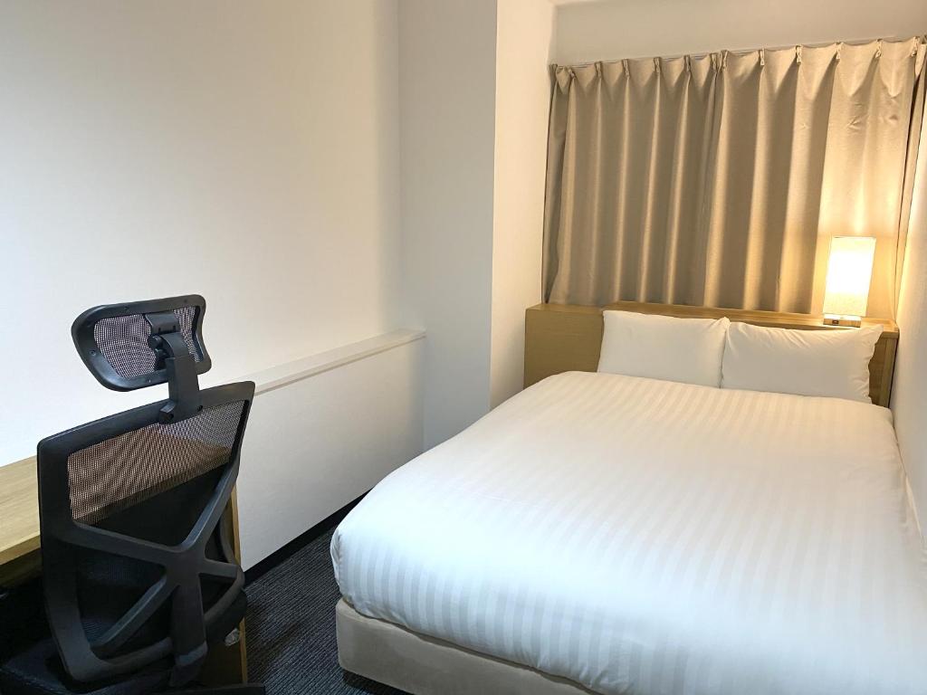 Postel nebo postele na pokoji v ubytování Santiago Hotel