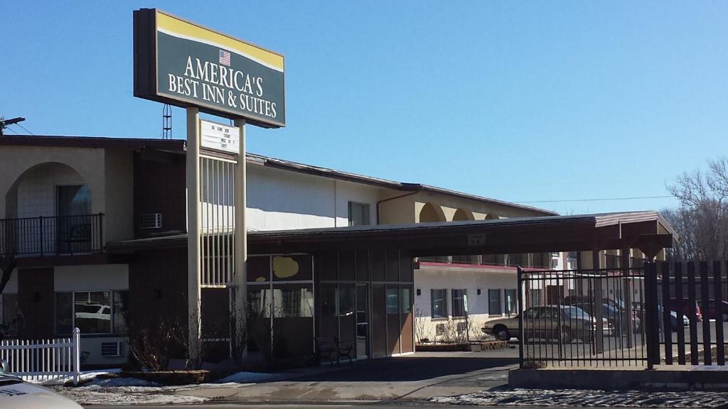 a building with a sign that reads american best university studios at Americas Best Inn & Suites Urbana in Urbana