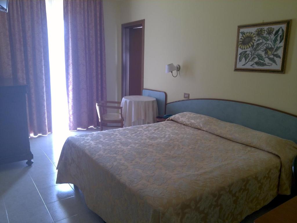 Posteľ alebo postele v izbe v ubytovaní Hotel Parco degli Ulivi