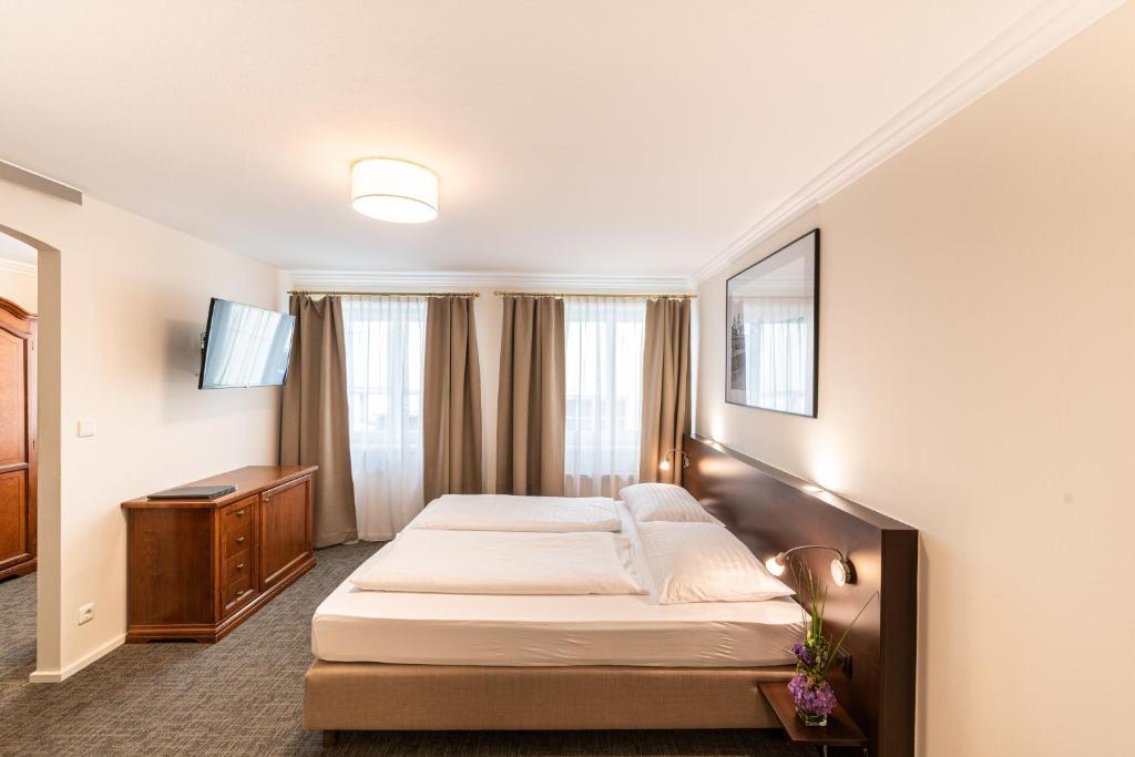 TV a/nebo společenská místnost v ubytování Altstadthotel Wolf-Dietrich