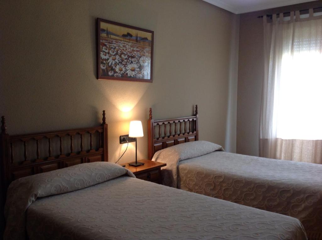 Posteľ alebo postele v izbe v ubytovaní Hostal Argentino