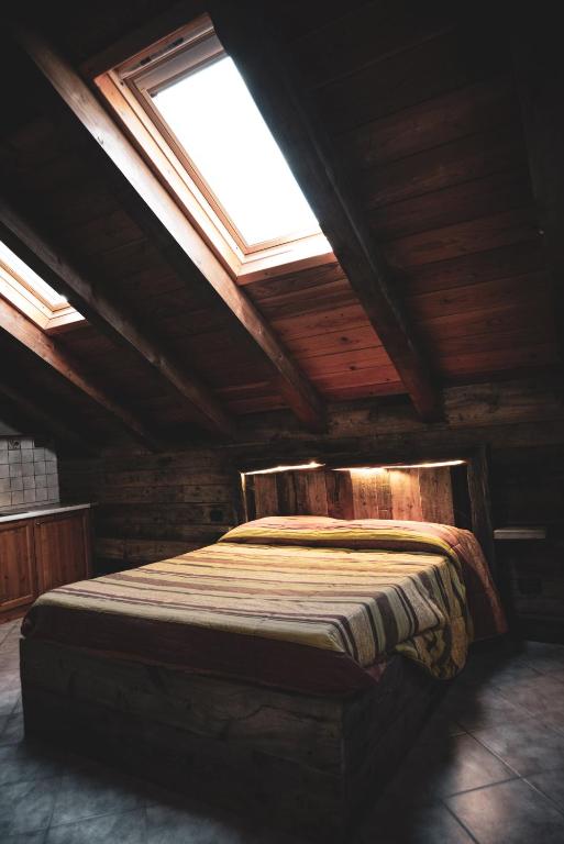 Postel nebo postele na pokoji v ubytování Chalet Della Guida