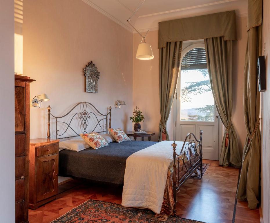 Posteľ alebo postele v izbe v ubytovaní Villa della Giovanna by VacaVilla