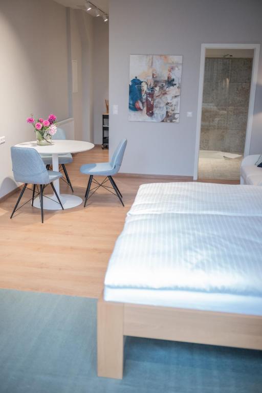 Posteľ alebo postele v izbe v ubytovaní Apartments Leopold Ferdinand