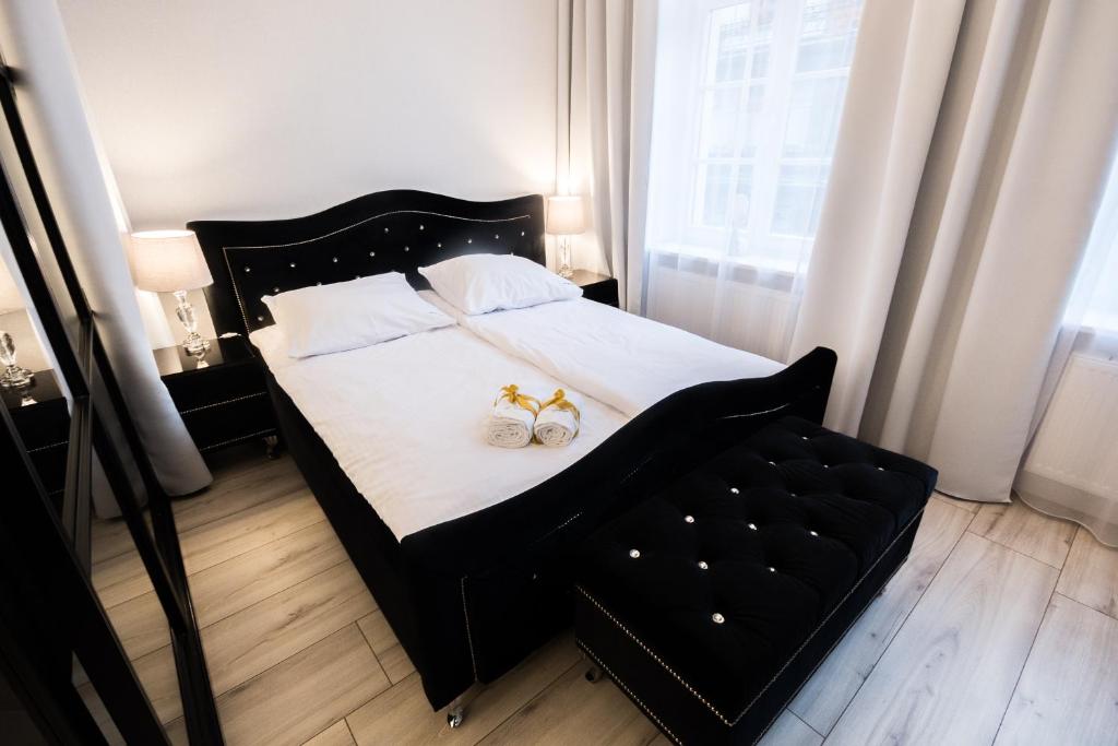 Łóżko lub łóżka w pokoju w obiekcie Glam Apartments