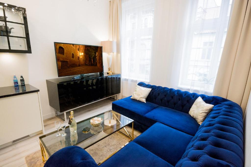 Telewizja i/lub zestaw kina domowego w obiekcie Glam Apartments