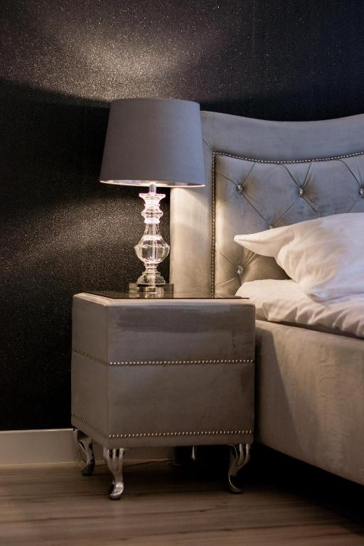 Łóżko lub łóżka w pokoju w obiekcie Glam Apartments
