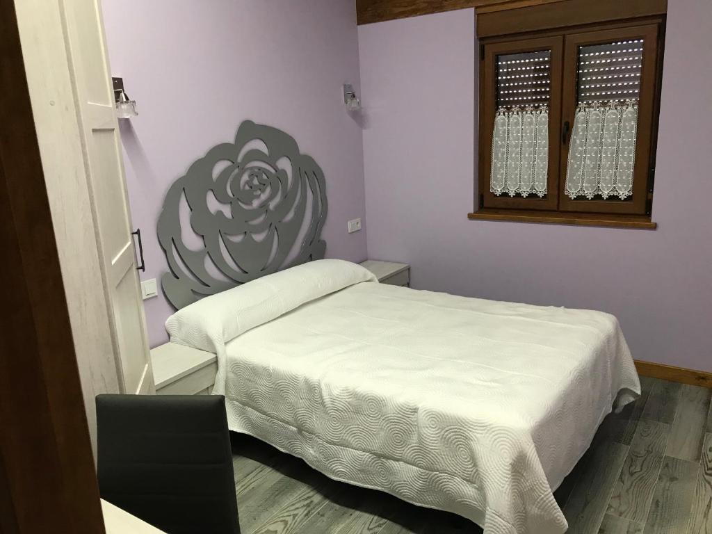 Postel nebo postele na pokoji v ubytování EL CARLOTO