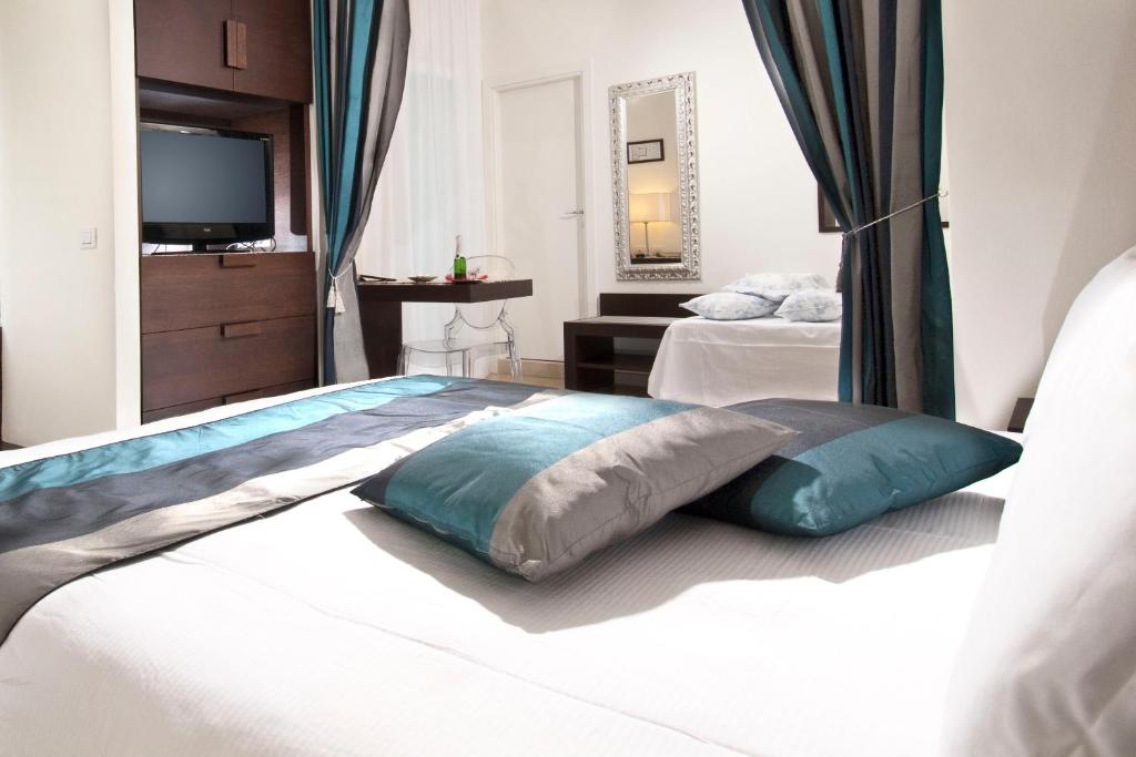 Postel nebo postele na pokoji v ubytování Hotel La Cappuccina