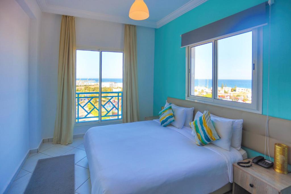 Postel nebo postele na pokoji v ubytování L'escale Appart-hôtel By 7AV HOTELS