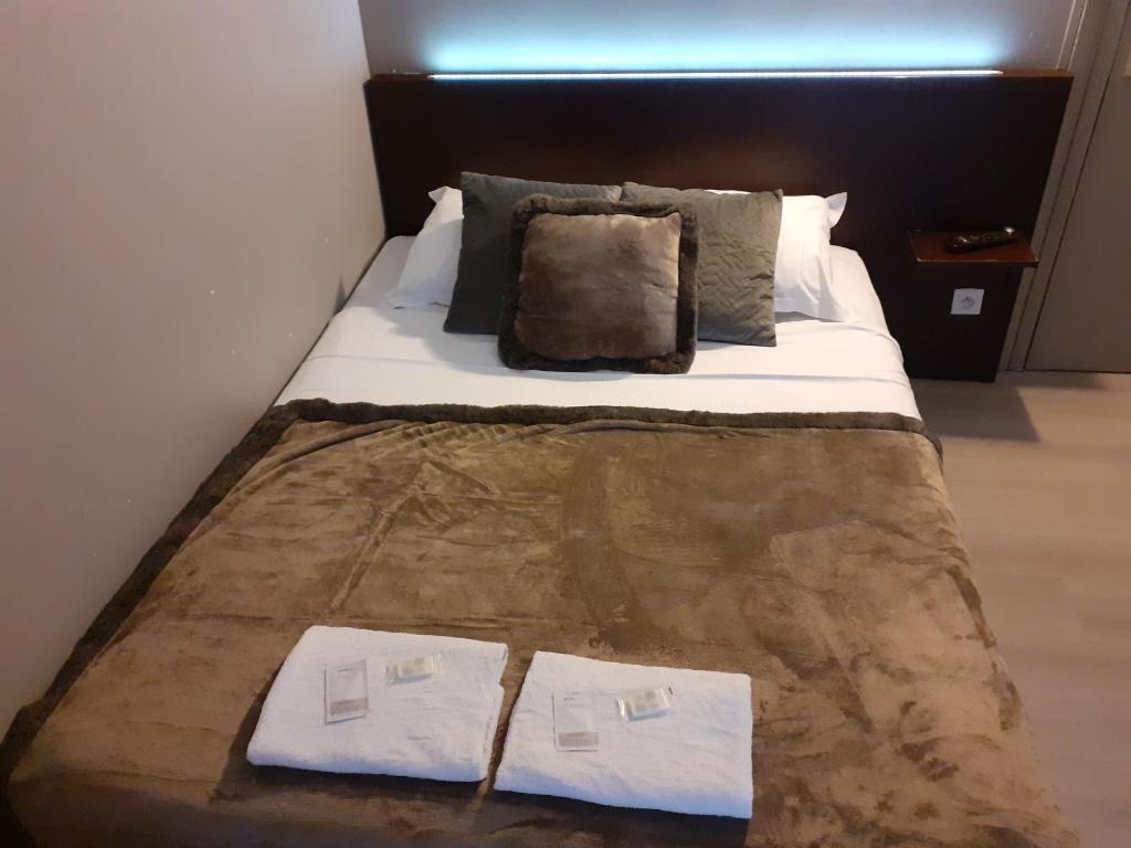 Postel nebo postele na pokoji v ubytování Citadel Hôtel