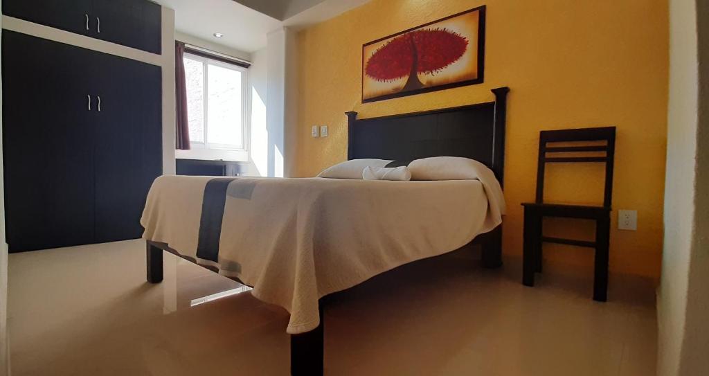 Postel nebo postele na pokoji v ubytování Hotel San Miguel