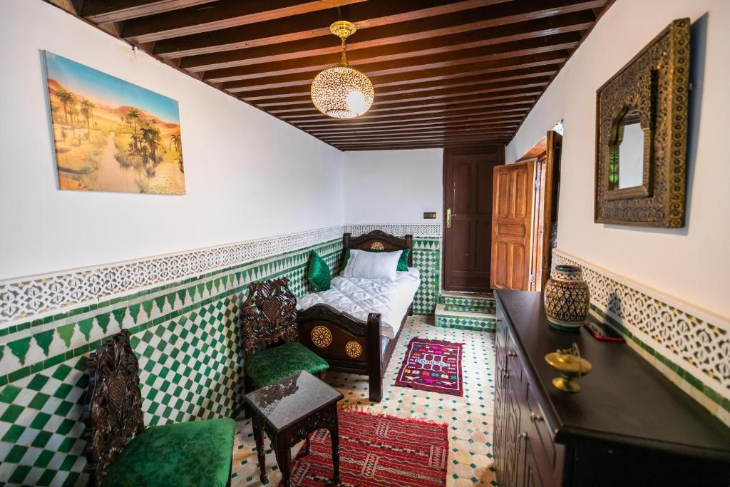 Postel nebo postele na pokoji v ubytování Palais Riad Chahd Luxury