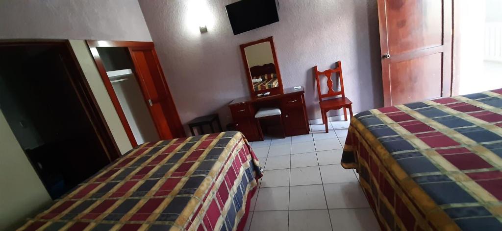 Postel nebo postele na pokoji v ubytování Hotel San Miguel