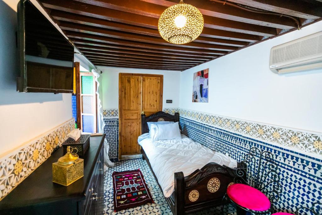 Postel nebo postele na pokoji v ubytování Palais Riad Chahd Luxury