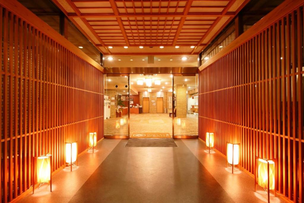 a hallway with lights on the floor of a building at Hotel OBANA in Nara