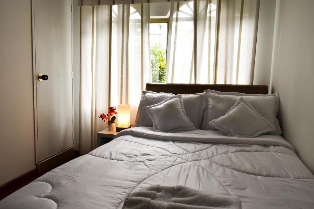 Postel nebo postele na pokoji v ubytování Casa Iris