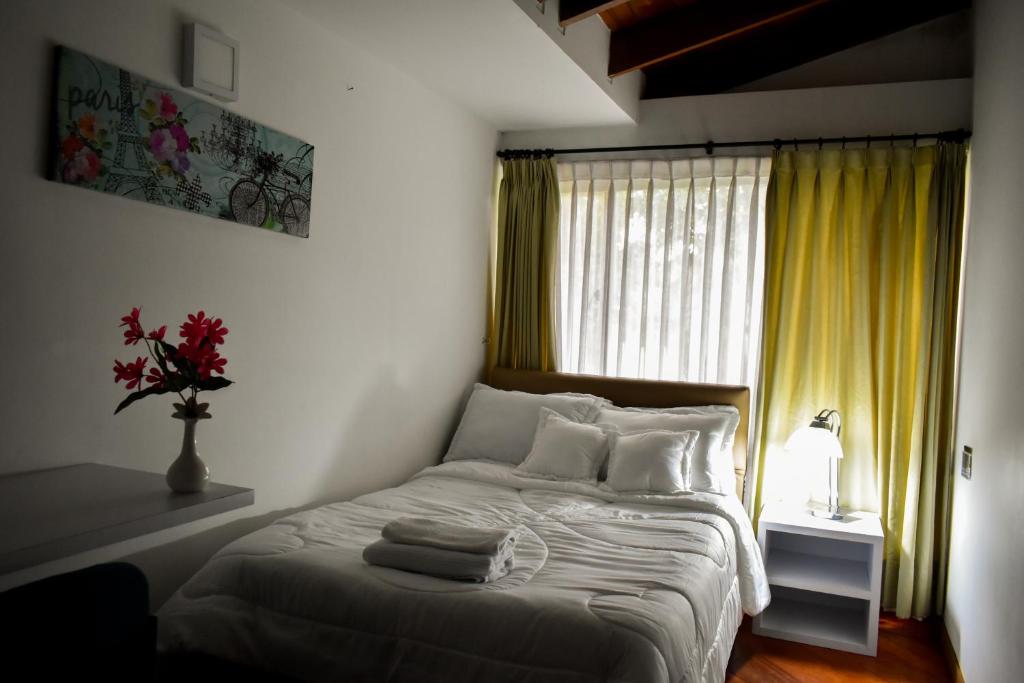 Postel nebo postele na pokoji v ubytování Casa Iris