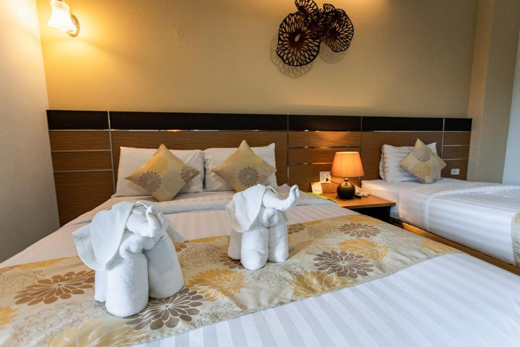 Cama o camas de una habitación en The Centris Hotel Phatthalung