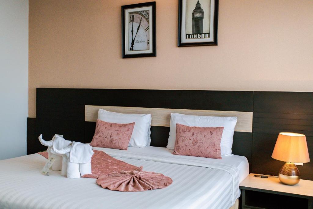 Cama o camas de una habitación en The Centris Hotel Phatthalung