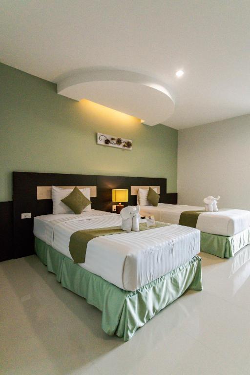 Cama o camas de una habitación en The Centris Hotel Phatthalung