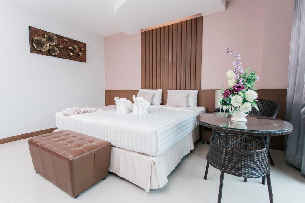 Cama o camas de una habitación en The Centris Hotel Phatthalung