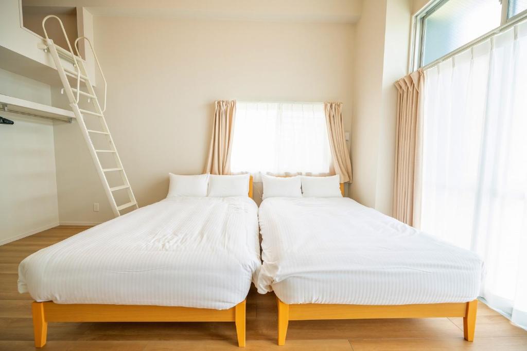 Voodi v&otilde;i voodid majutusasutuse Hotel Tomas Asahibashi Station toas
