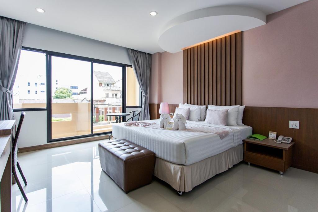 Cama o camas de una habitación en The Centris Hotel Phatthalung