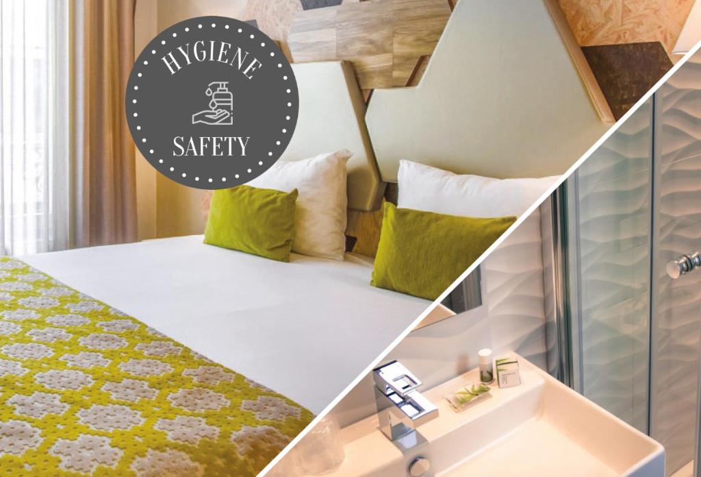 パリにあるプランス アルベール ワグランの緑と白の枕付きのベッドが備わる小さな客室です。