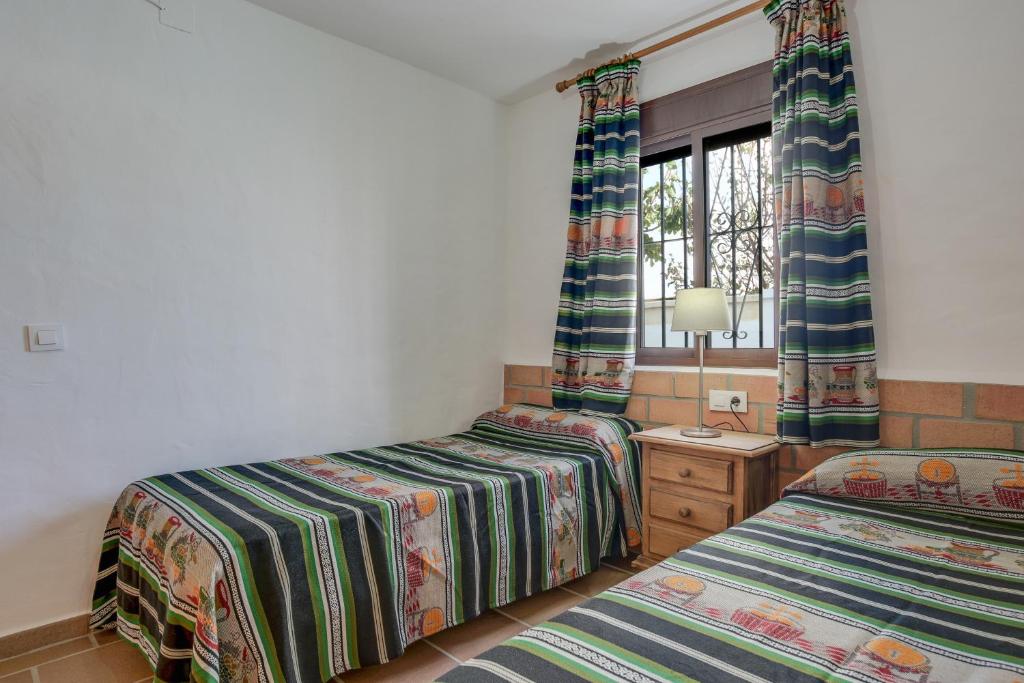 Posteľ alebo postele v izbe v ubytovaní Casa Miguelin