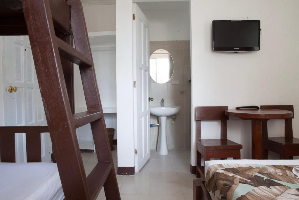 Postel nebo postele na pokoji v ubytování Isla Gecko Resort