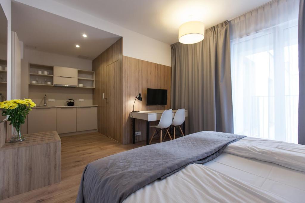 Posteľ alebo postele v izbe v ubytovaní Aparthotel City Break Wolska