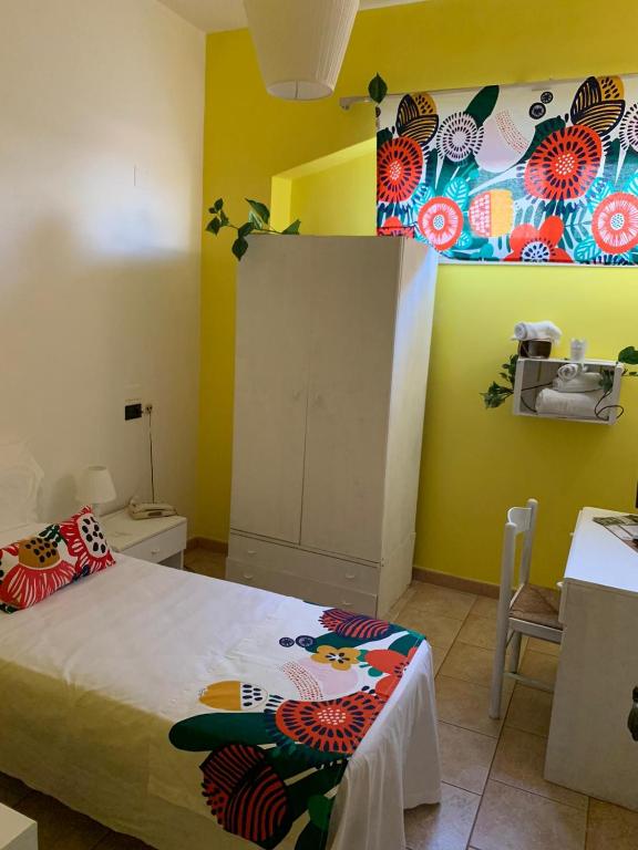 Posteľ alebo postele v izbe v ubytovaní Paradiso della Zagara