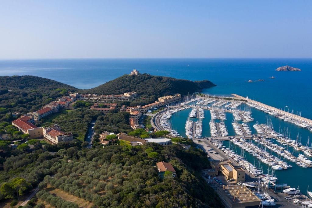 an aerial view of a marina with boats at Punta Ala Sea View Apartments in Punta Ala