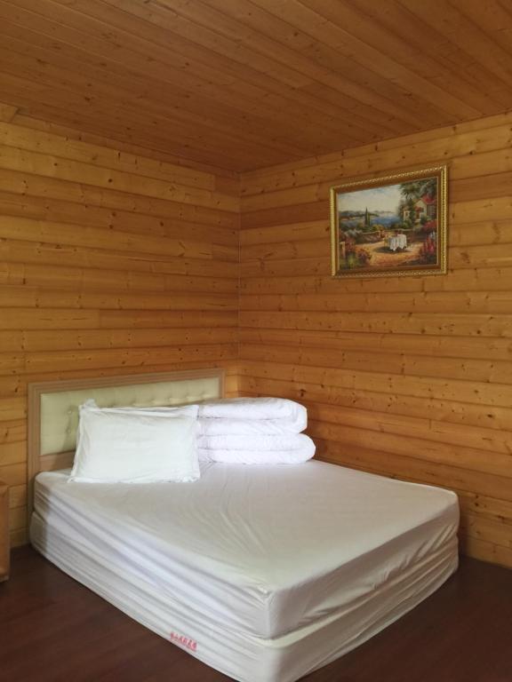Postel nebo postele na pokoji v ubytování Yun Hsiang Zhan Chalet