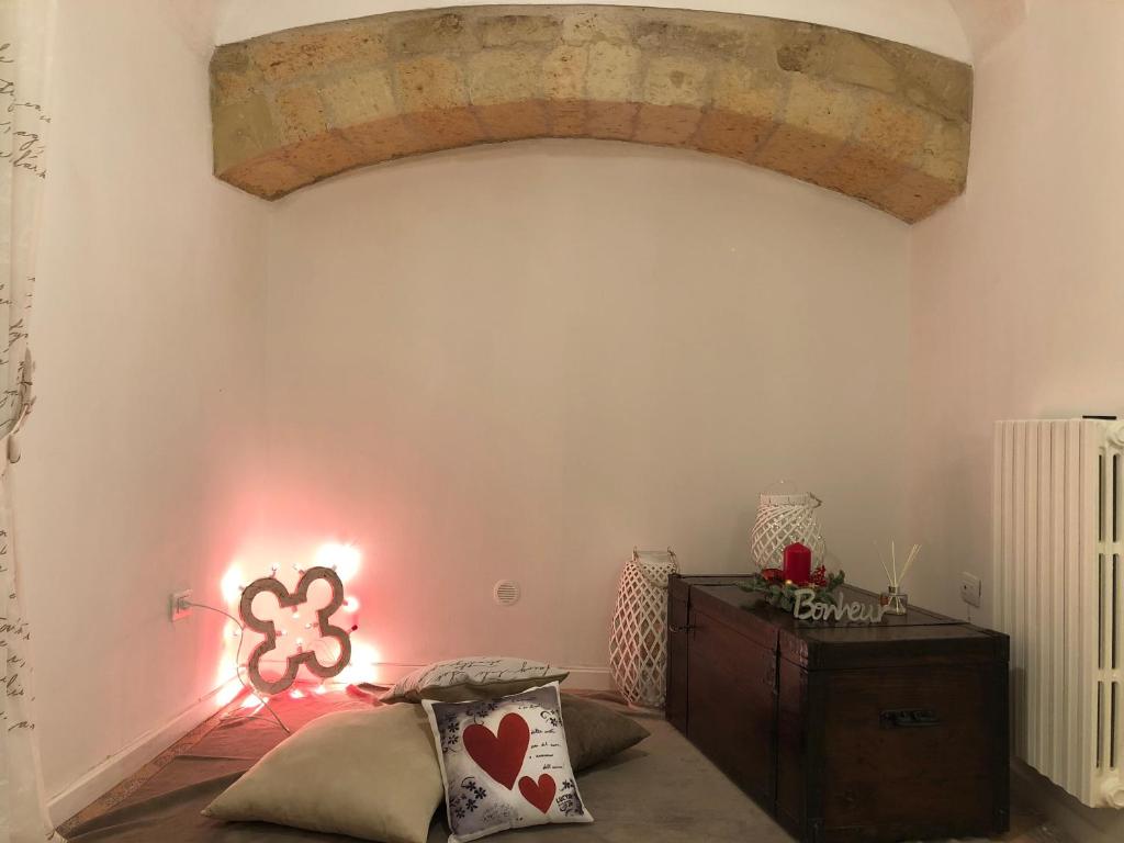 A bed or beds in a room at MaGiA