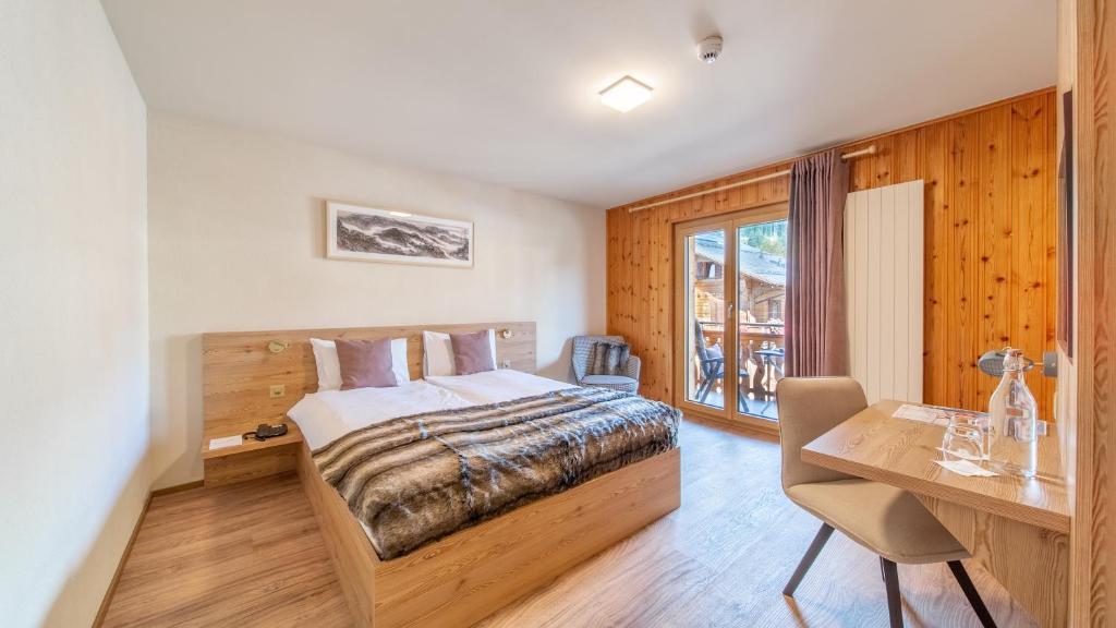 Postel nebo postele na pokoji v ubytování VIU Hotel Villars