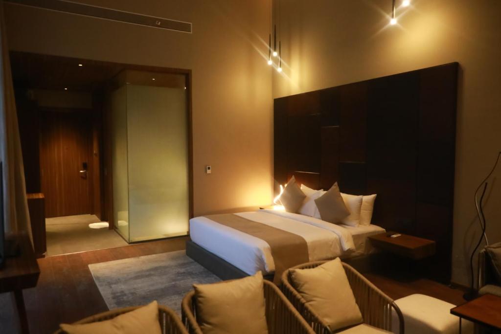 Postel nebo postele na pokoji v ubytování Aria Resort & Spa