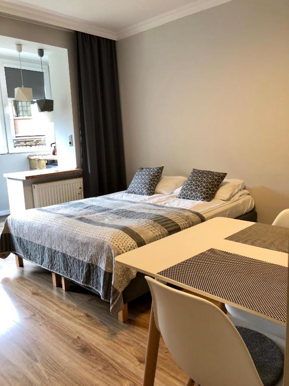 Posteľ alebo postele v izbe v ubytovaní Apartamenty Old Town Mniszki