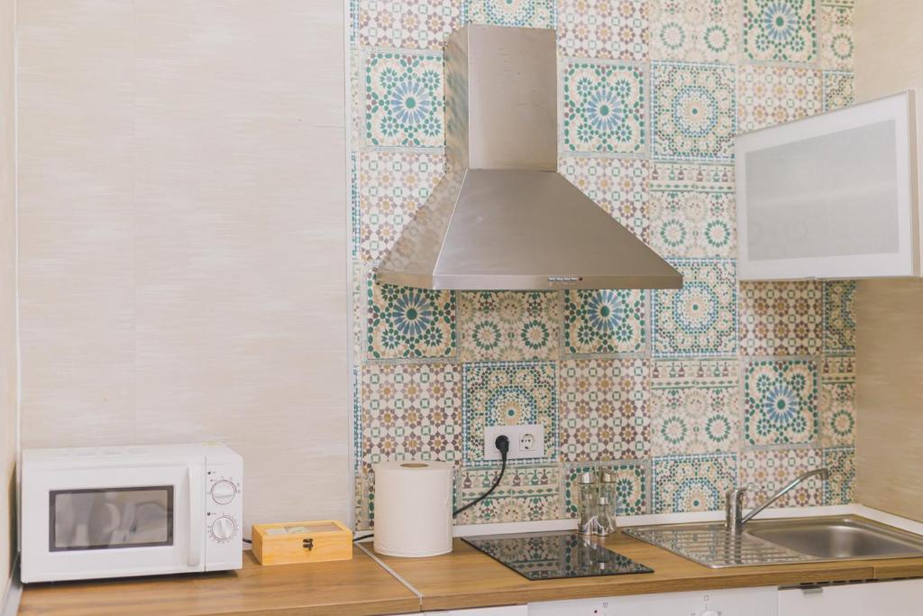 A kitchen or kitchenette at Apartamentos casa palacio