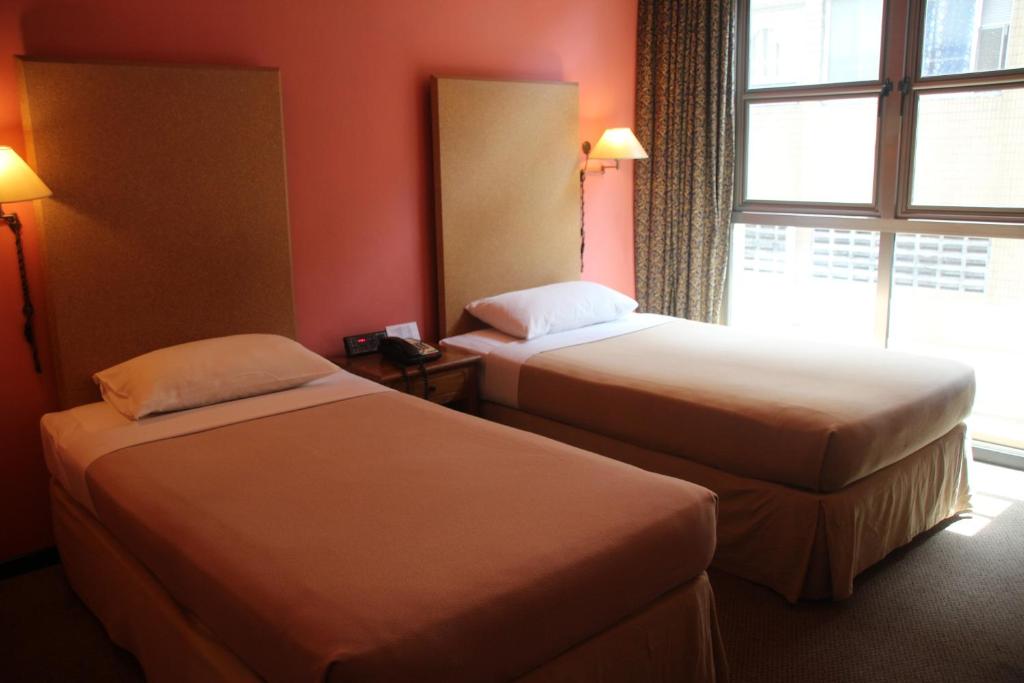 Postel nebo postele na pokoji v ubytování Classique Hotel