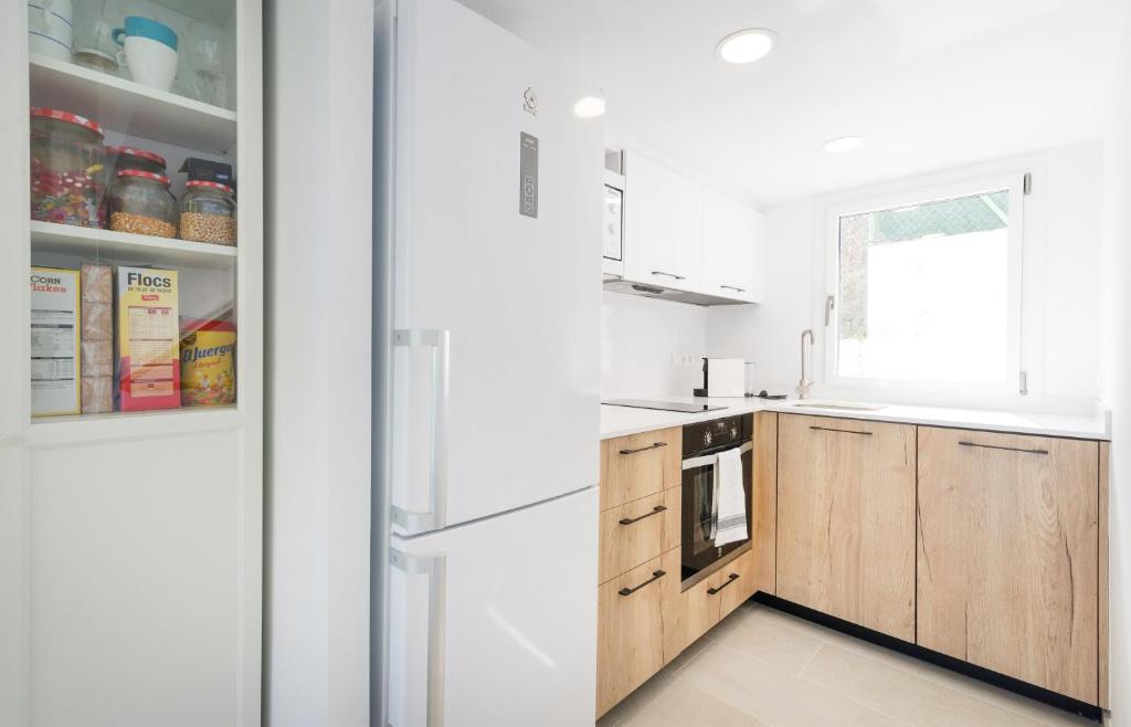 Kuchyň nebo kuchyňský kout v ubytování Vela Blanca SA RIERA duplex w private parking